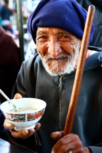 Poor man begging for food in Marrakech